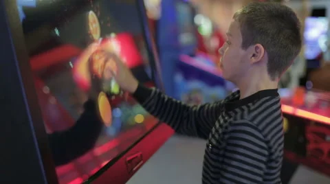 A boy playing a game on the game simulator Stock Footage 64952162