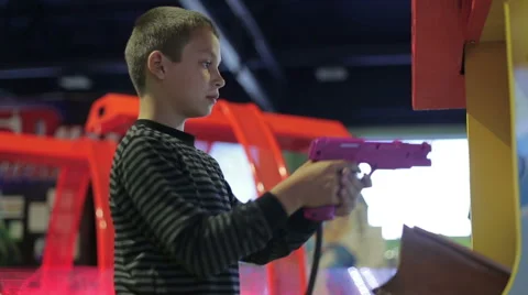 A boy playing a game on the game simulator Stock Footage 65015079