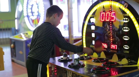 A boy playing a game on the game simulator Stock Footage 65417546