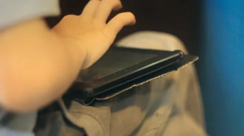 A boy playing a game on the tablet. Filmed with slider. Stock Footage 51879160