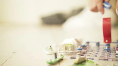 Boy playing games with the construction set. The child enthusiastically collects Stock Footage 165199218