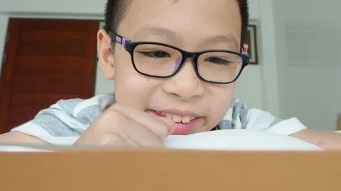 Boy playing games on digital tablet computer Stock Footage 89267854