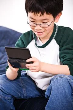 Boy playing games Stock Photos