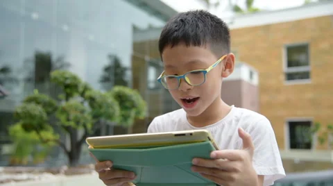 Boy playing games on tablet computer Stock Footage 67488971