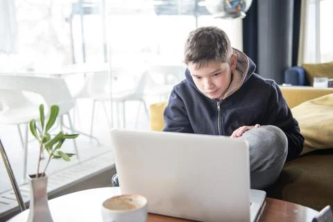 Boy  playing  games with a tablet computer device Stock Photos