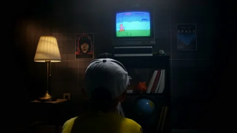 Boy playing games on video game console Stock Footage 213434545