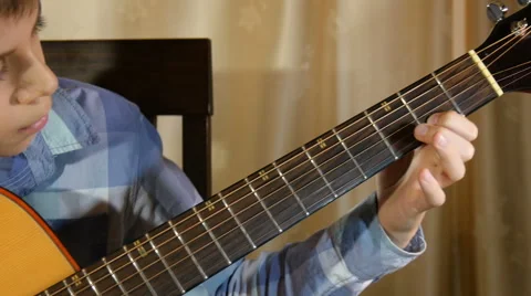 Boy playing guitar Video stock 63629732