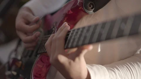 A boy playing a guitar. Stock Footage 231424474