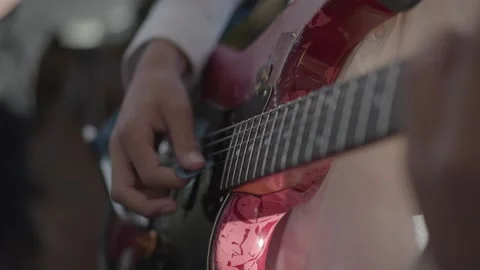 A boy playing a guitar. Stock Footage 231424574