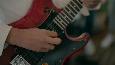 A boy playing a guitar. Stock Footage 231424609