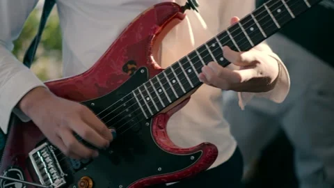 A boy playing a guitar. Stock Footage 231424717