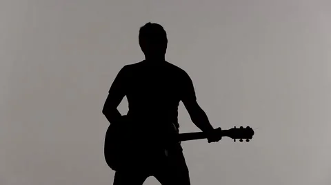 Boy playing guitar only the silhouette Stock Footage 40648944