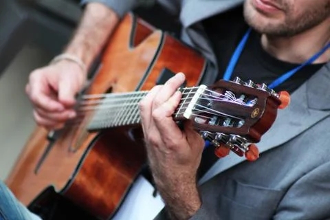 Boy playing guitar Stock Photos