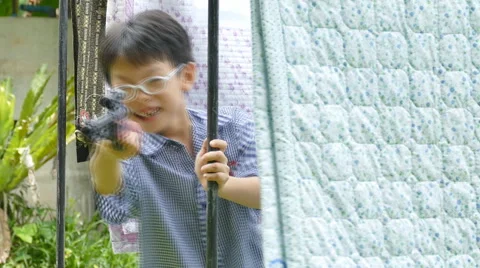 Boy playing with gun. Stock Footage 55810166