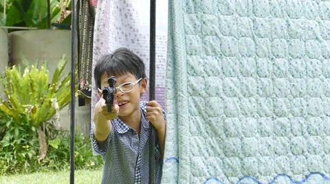 Boy playing with gun. Stock Footage 55813517