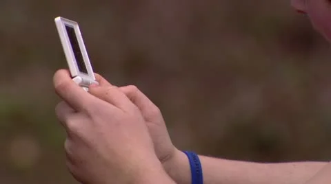 Boy playing with handheld console Stock Footage 11924440
