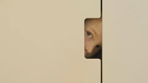 Boy playing hide and seek Stock Footage 97761411