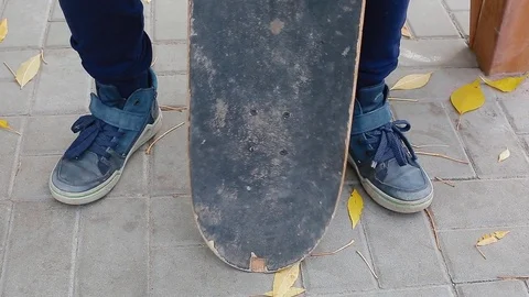 Boy playing with his skate Stock Footage 83993877