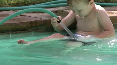 Boy Playing with Hose in Pool HD 05 Stock Footage 11578388