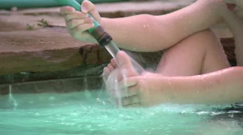 Boy Playing with Hose in Pool HD 04 Stock Footage 11578422