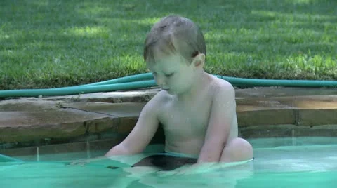 Boy Playing with Hose in Pool HD 01 Stock Footage 11578558