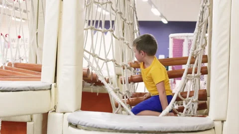 Boy playing in indoor rope park. Stock Footage 264497807