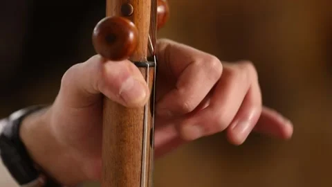 The boy is playing kamancha 5 Stock Footage 310028292