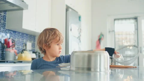 Boy playing in the kitchen Stock Footage 279267113