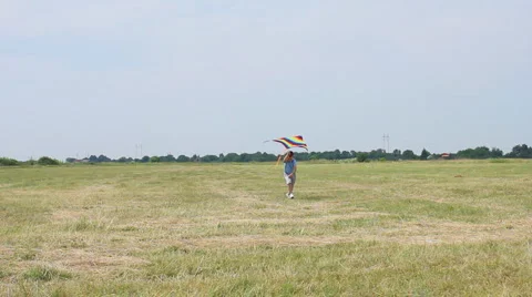 Boy playing kite Stock Footage 5943528