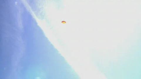 Boy playing with kite over blue sky Stock Footage 496814