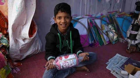 Boy playing with kite winder.Slow motion Stock Footage 84625319