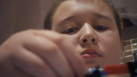 Boy playing with Lego blocks Stock Footage 73057059