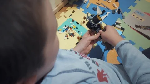 Boy playing with Lego blocks Video stock 73057186