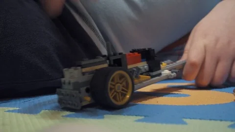 Boy playing with Lego blocks Stock Footage 73057361