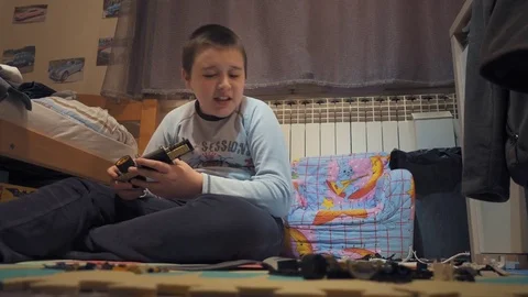 Boy playing with Lego blocks Video stock 73057380