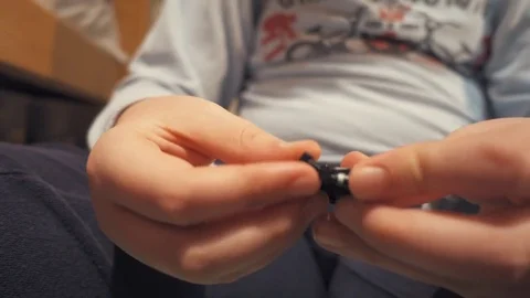 Boy playing with Lego blocks Stock Footage 73057645