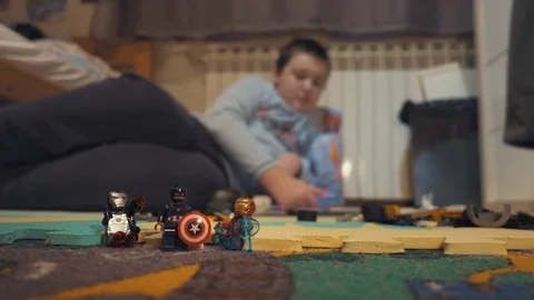 Boy playing with Lego blocks Video stock 73057709