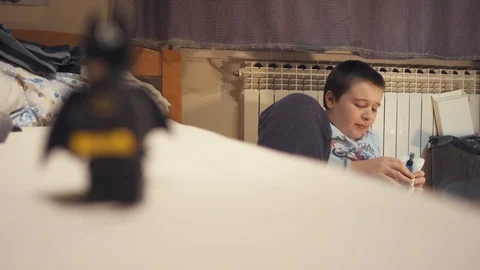 Boy playing with Lego blocks 스톡 동영상 73057816