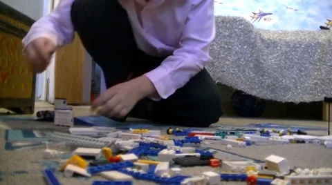 Boy playing with lego Stock Footage 59942587
