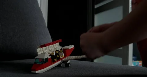 The Boy Playing With Lego Pieces at Home Vídeo Stock 65636627