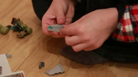 Boy playing with Legos Video stock 48027119
