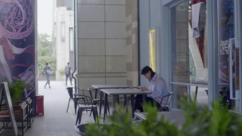 Boy playing mobile game happily Stock Footage 240974211