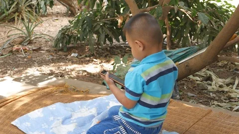 Boy playing with mobile phone Stock Footage 71331453