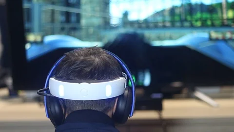 Boy playing in a modern virtual reality helmet Stock Footage 87134555