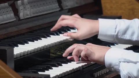 Boy playing organ Stock Footage 119369517