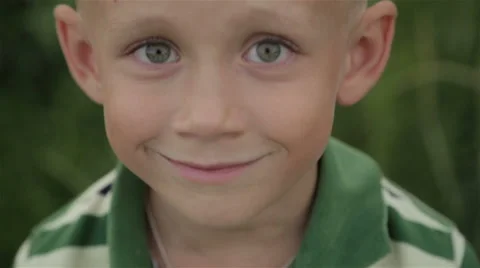Boy playing outdoors Stock Footage 64776614