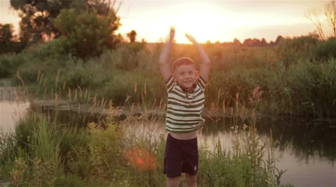 Boy playing outdoors Stock Footage 65075674