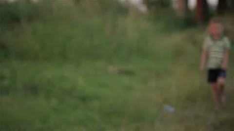 Boy playing outdoors Stock Footage 65076585