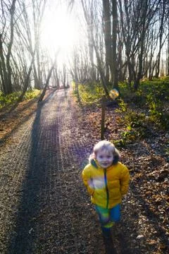 Boy playing outside in forest he is happy and carefree Stock Photos