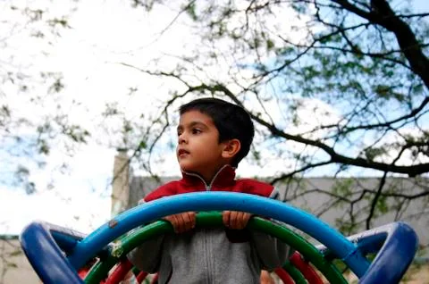 Boy playing in the park Stock Photos